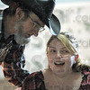 SmugMug > keywords > talk > Band: Carl Compton and Sierra Cooper  chat during Saturday's fundraiser in Clinton. Compton is a member of the "Country Music Makers" band dontating their services for her.