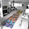 SmugMug > all-time keyword > installation > Spring 2009: Colorful Clan Wedding Installation layout, 99 graphic panels of friends and family color coded, velcro LeanBean and I-Pod condom mock-up above