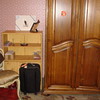 SmugMug > keywords > next > Taken from the bed.  The ugly little storage thing will go with the tenant, and I will put bookshelves instead.  I will probably get rid of the chair, unless it finds a home in another room.