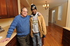 SmugMug > keywords > shea > 12-18-09 BALTIMORE, MD-  Christopher Shea, President and CEO of EBDI standing in the kitchen of their Greenhab model home at 1714 E. Chase Street in East Baltimore with neighborhood resident Jonny Coleman, who is benefiting from the home repair grant that is being offered in the area.  Photo by Maximilian Franz/ The Daily Record