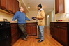 SmugMug > keywords > shea > 12-18-09 BALTIMORE, MD-  Christopher Shea, President and CEO of EBDI standing in the kitchen of their Greenhab model home at 1714 E. Chase Street in East Baltimore with neighborhood resident Jonny Coleman, who is benefiting from the home repair grant that is being offered in the area.  Photo by Maximilian Franz/ The Daily Record