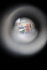 SmugMug > keywords > shea > 12-18-09 BALTIMORE, MD-  Christopher Shea, President and CEO of EBDI. He shown here looking through the peep hole on the front door while standing outside of their Greenhab model home at 1714 E. Chase Street in East Baltimore.  Photo by Maximilian Franz/ The Daily Record