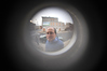 SmugMug > keywords > shea > 12-18-09 BALTIMORE, MD-  Christopher Shea, President and CEO of EBDI. He shown here looking through the peep hole on the front door while standing outside of their Greenhab model home at 1714 E. Chase Street in East Baltimore.  Photo by Maximilian Franz/ The Daily Record