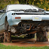 SmugMug > all-time keyword > mechanic > Zach's totally imperfect car - He's planning to have it fixed someday!
Don't you love/hate how it's propped up?
Someday it'll be fixed... in the meantime I'm 'trying' not to look.

PS: I should have added: He himself (my son) is in the process of fixing it up... 
He bought another one that's the same make, model and year in even worse shape 
but the motor & other parts are good so he's using them to put in this one.
Crazyness :-)
