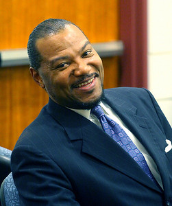  > Michael Ross talks to a friend during a break in his trial.