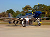 SmugMug > keywords > pull > The throaty, turbine-like roar of the P-51's 1750 HP Merlin 61 engine is unike any other WWII fighter, and must be the sweetest sound in aviation. Listening to a high speed "fly-by" is unforgettable.  In the summer of 2004 I flew this immaculate $2 million piece of history in one glorious hour of acrobatic maneuvers reaching speeds of 370+MPH. It is a special-built two seater with dual flight controls. The instructor gave me control within seconds of takeoff. After fully checking me out at 8000 feet, he let me perform moves that included straight rolls, vertical figure 8's, loops, half loops, Immelmans, barrel rolls, a Split S, and high speed tight turns. For weeks I practiced the stick and rudder moves in a chair at home, but the Mustang was so powerful that these maneuvers were easier than I expected. In a high speed, low G, 20 second loop it seems to defy gravity, the engine RPM barely dropping as it climbs vertical and with minimal engine "runaway" on the down side. At my request, the instructor flew a thrilling vertical corkscrew topped by an inverted recovery, a lengthy high speed 90 degree dive and tight pullout that caused me to lose partial consciousness for several seconds. Generally, more fun that I could adequately describe.