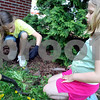 SmugMug > keywords > beautify > Londonderry: Members of the Abenaki Pathfinders were helping out during "Beautify Londonderry," on Saturday morning at the Central Fire Station, the Common and at Moose Hill Kindergarten. Jenna Brooks, 10, left, and Adrianna Belanger, 7, were busy weeding and then spreading mulch with their dads at the Central Fire Station. Photo by Allegra Boverman/Derry News Saturday, May 16, 2009