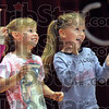 SmugMug > keywords > participate > Audience participation: Two young girls have the time of their young lives as they participate on stage during the Greg and Steve Children's Concert Saturday afternoon.