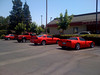SmugMug > keywords > are > My Red S-10 & 3 other Red Vehicles all in this one section of the parking lot and no other cars present.