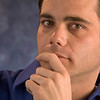 SmugMug > all-time keyword > suspicious > A man with his hand on his chin looking skeptical.