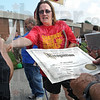 SmugMug > all-time keyword > recognition > Recognition: Ryves Hall community organizer Leah Myers passes out certicicates of recognition to the staff of Chauncey-Rose Middle School during Tuesday's Royal Pride Party event.