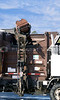 SmugMug > all-time keyword > dispose > A garbage truck automatically emptying a trash can.